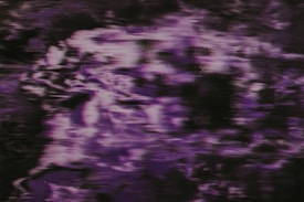 Abstract pattern with hues of purple and black, creating a swirling and textured effect. The movement suggests fluidity and an almost mystical, otherworldly appearance.