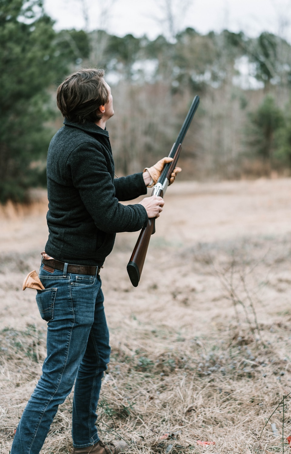 A man clay shooting looking in the air