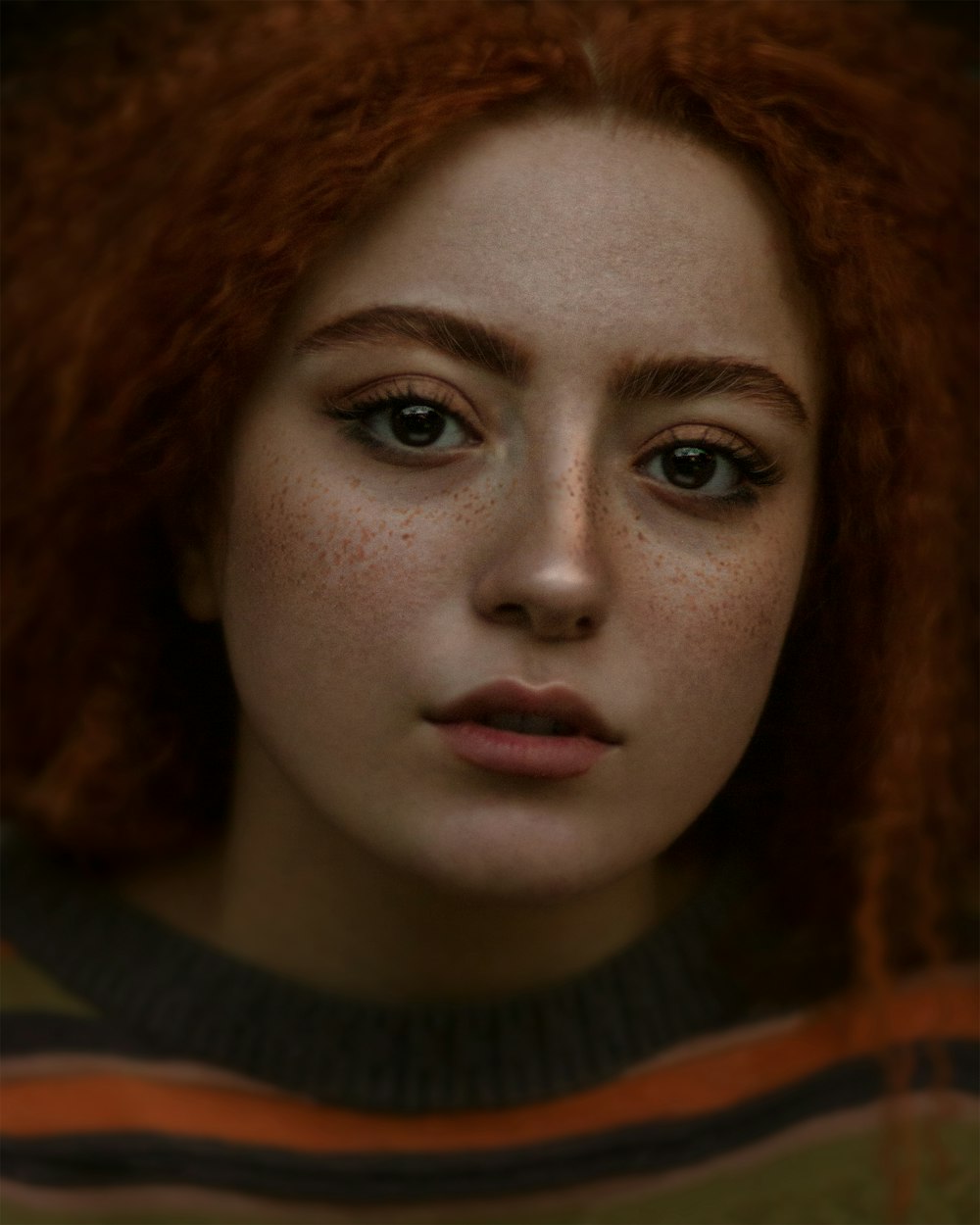 woman in brown and white shirt