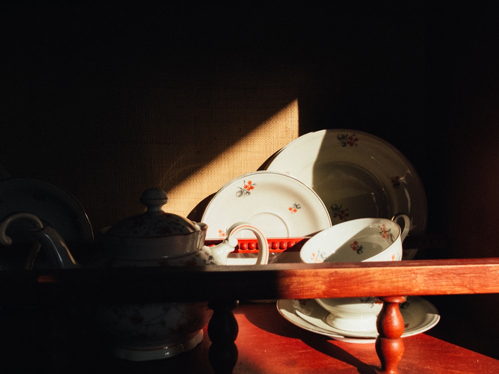 white ceramic plate on brown wooden table