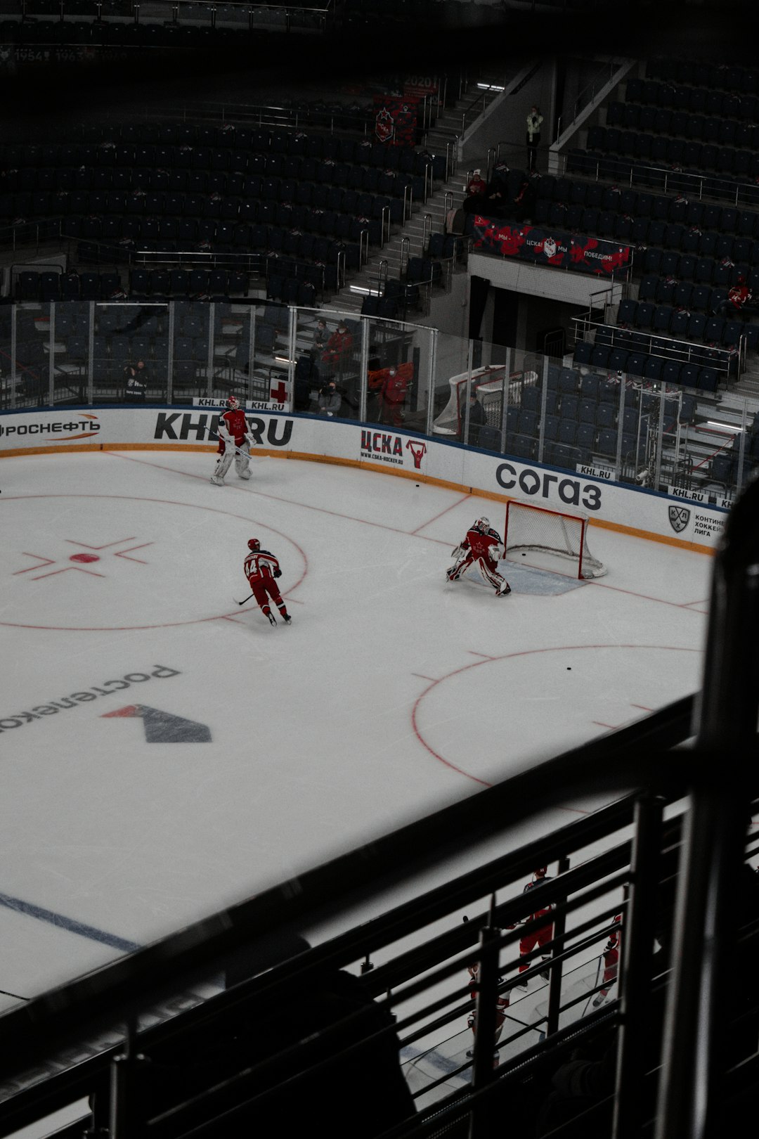 people playing ice hockey on ice stadium