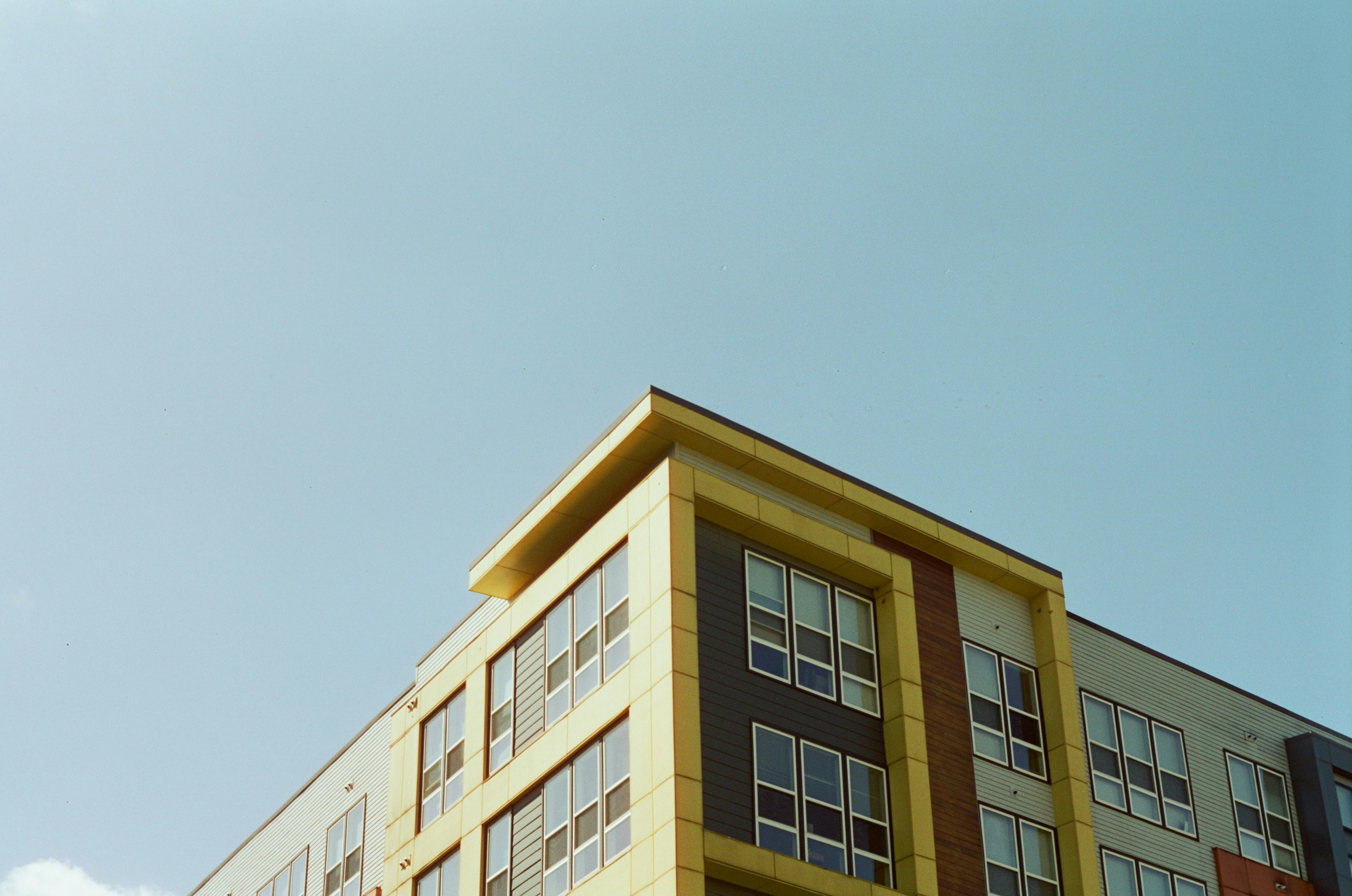 beige concrete building under blue sky during daytime