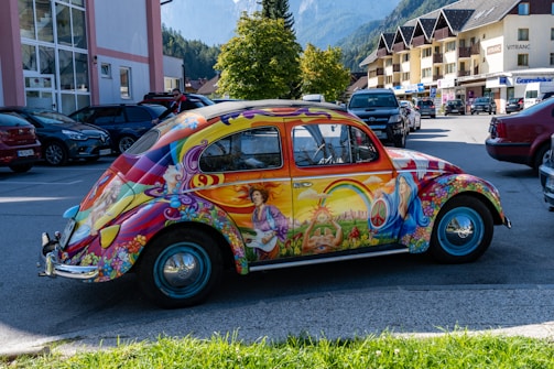 A vibrant vintage Beetle car illustration on a colorful t-shirt.