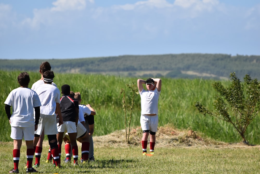 people on green grass field during daytime