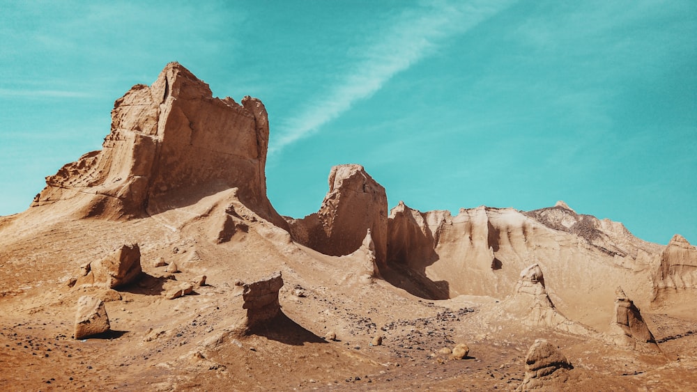 brown rock formation under blue sky during daytime