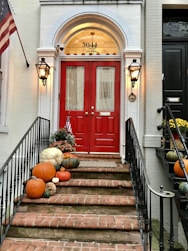 red wooden door on brown concrete staircase