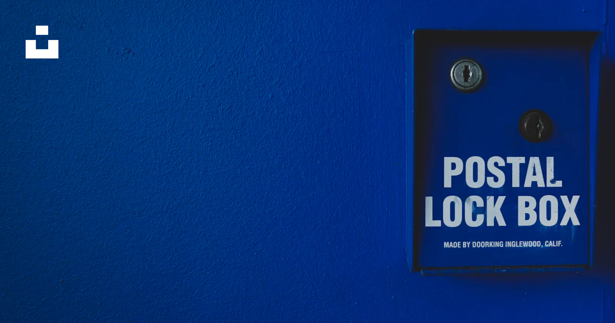 Posted Lock A blue wall with a sign that says postal lock box photo – Free Lock box ...