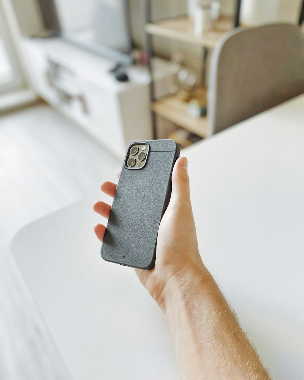 person holding black smartphone case