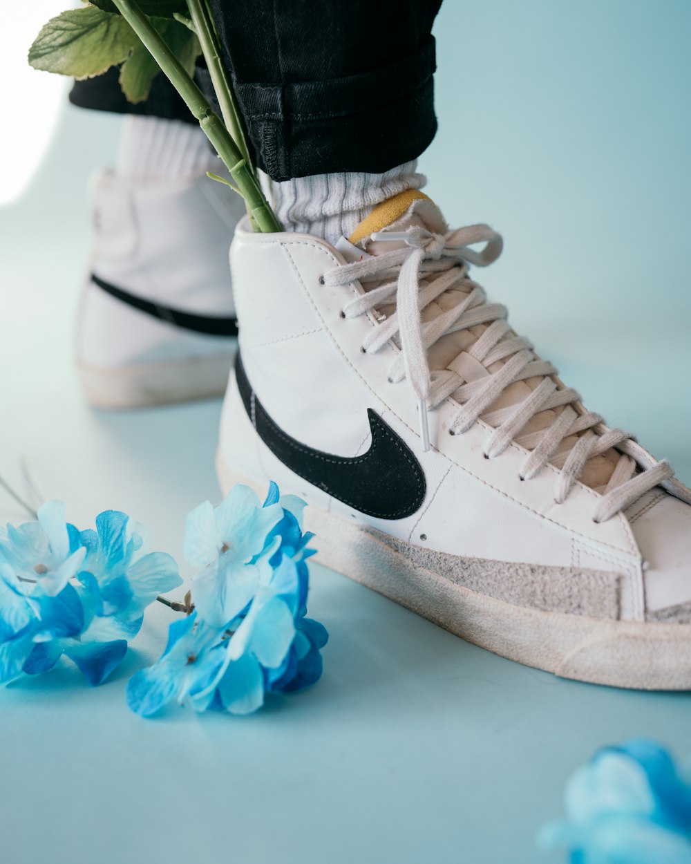 white and black nike high top sneakers photo – Free United states Image on  Unsplash