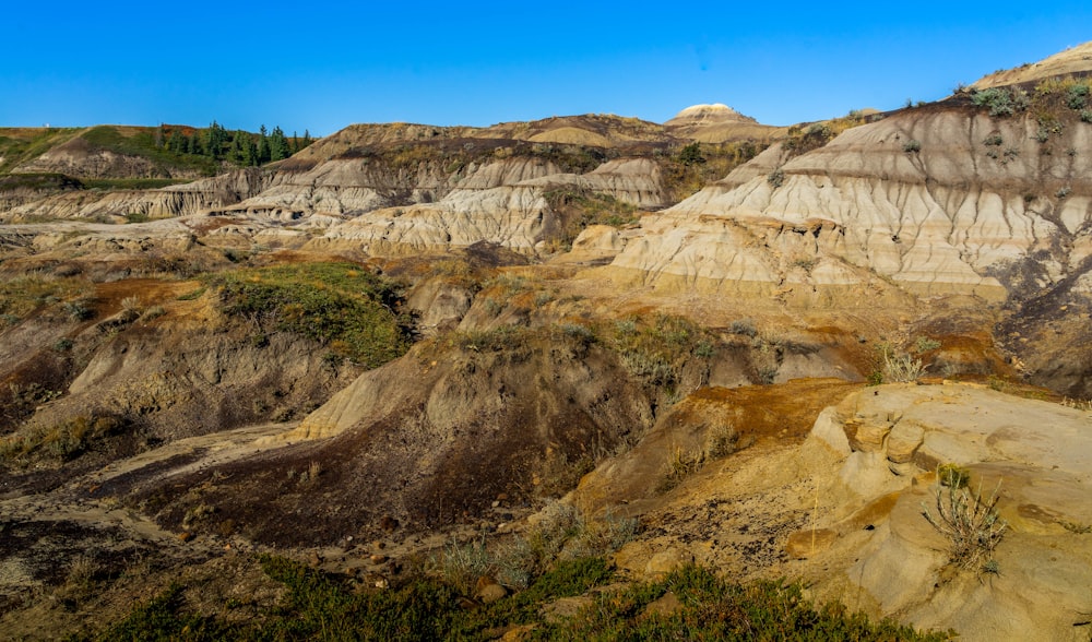 brown rocky mountain under blue sky during daytime