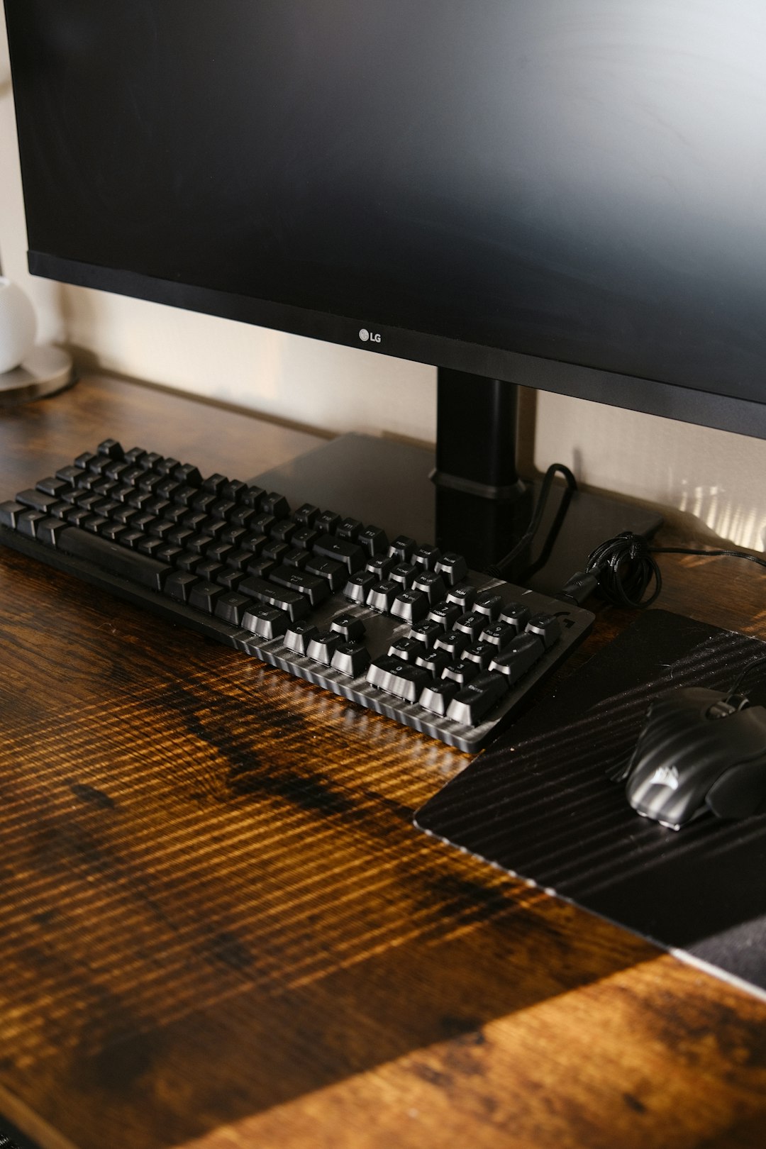 black computer keyboard beside black flat screen computer monitor