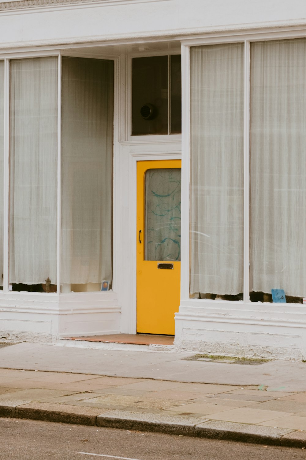 white and yellow wooden door