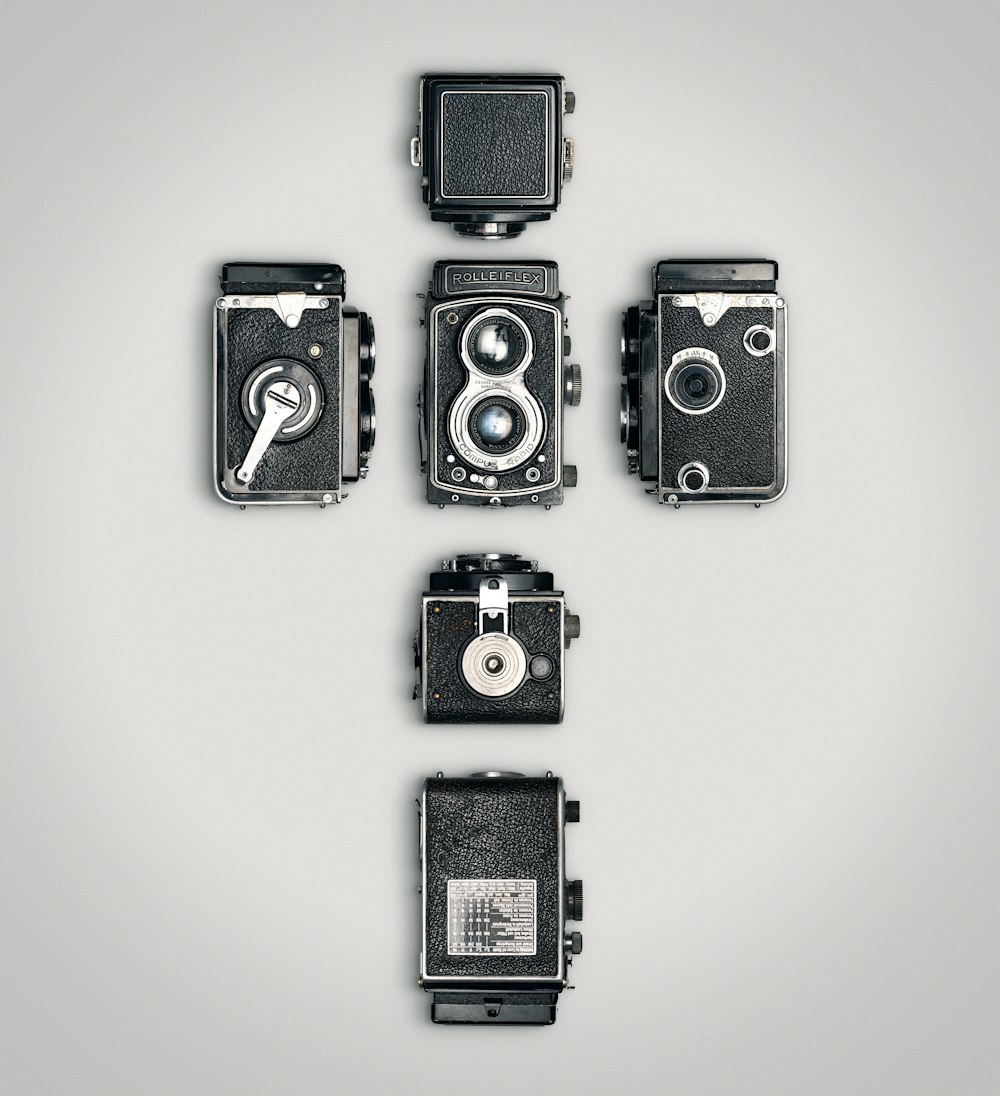 black and silver camera on white surface