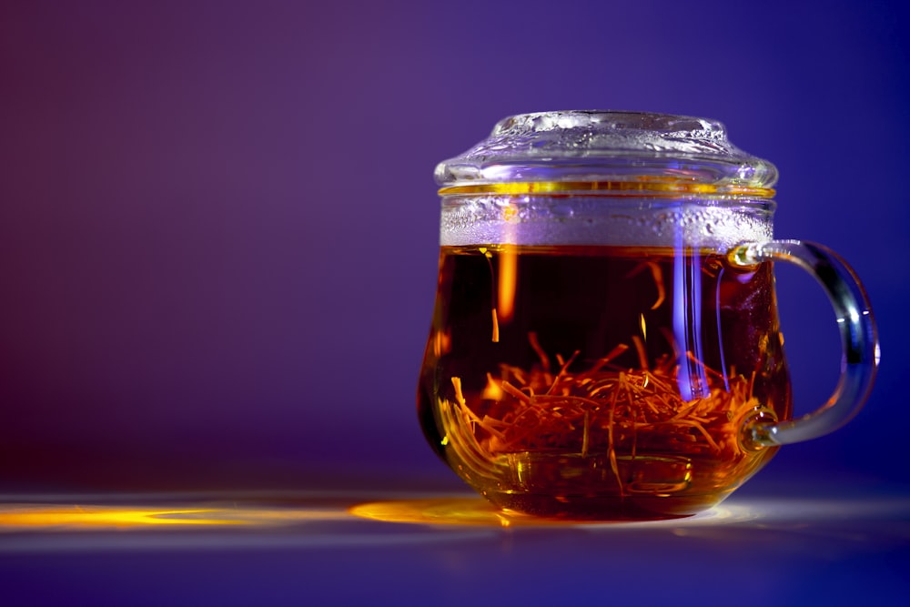 clear glass jar with brown liquid