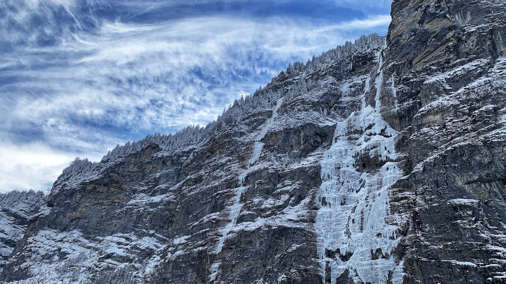 gray rocky mountain under blue sky during daytime