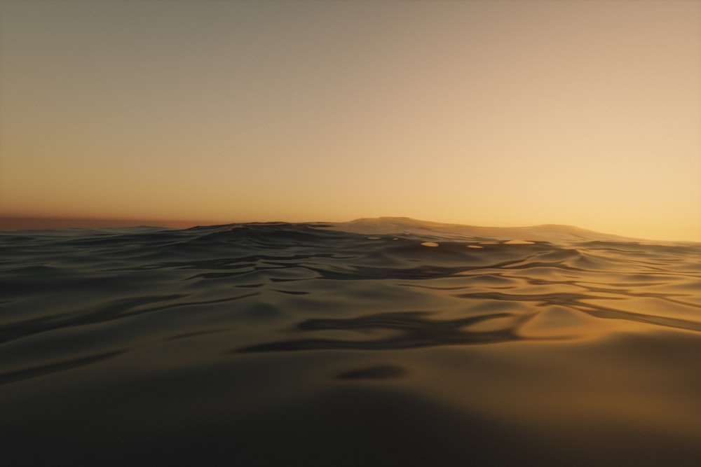 body of water during sunset