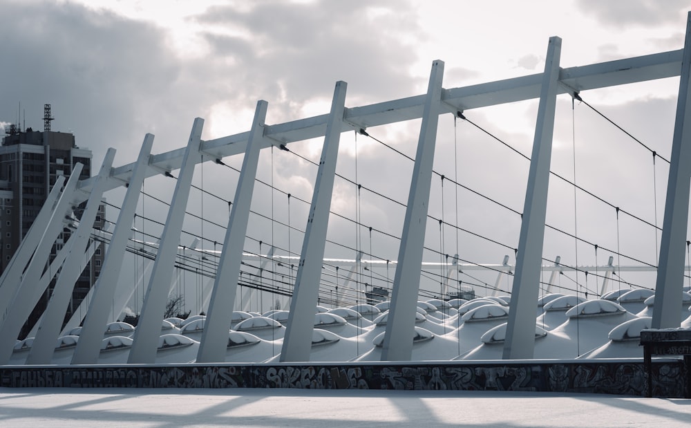 white metal frame under white clouds during daytime