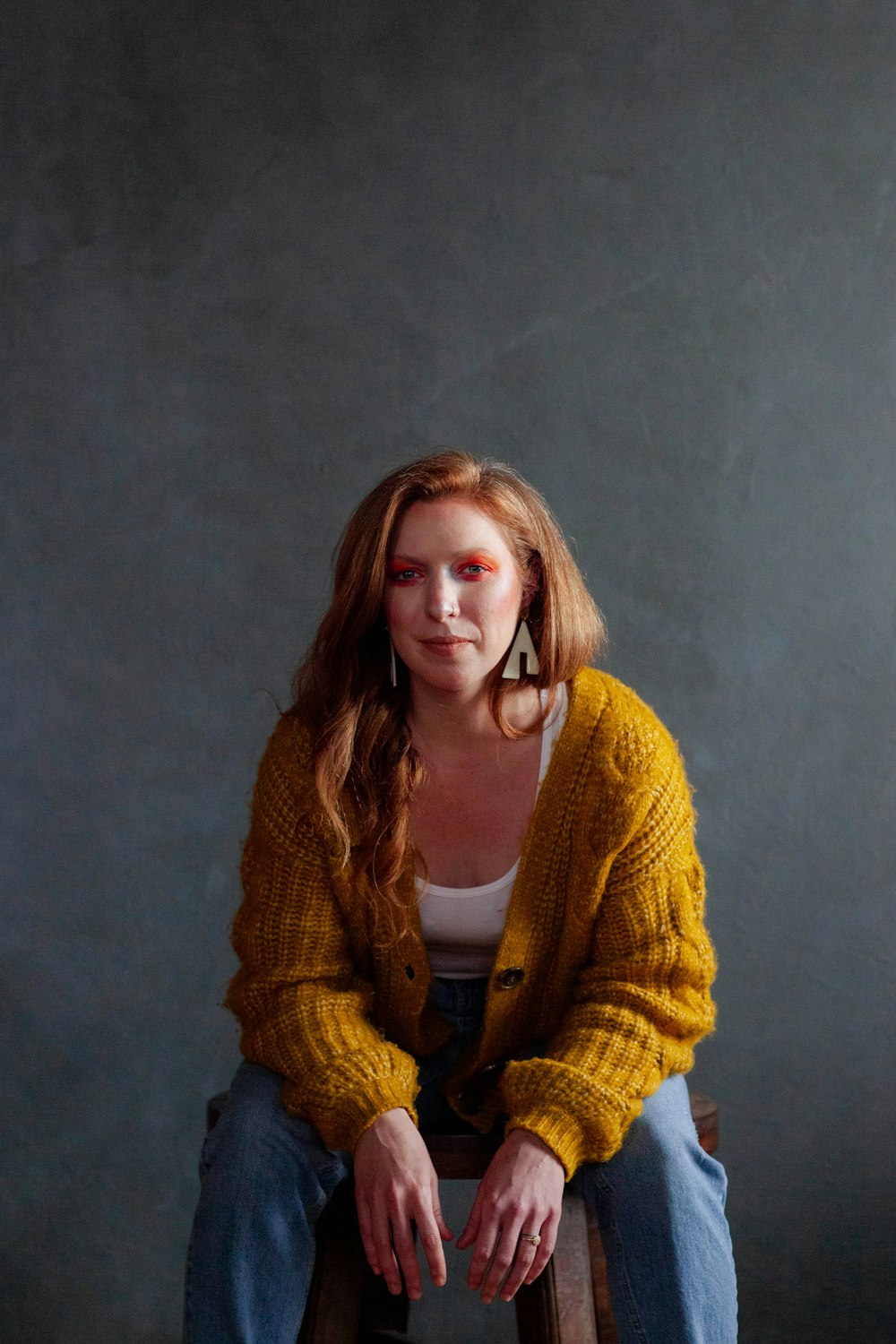 woman in yellow knit cardigan