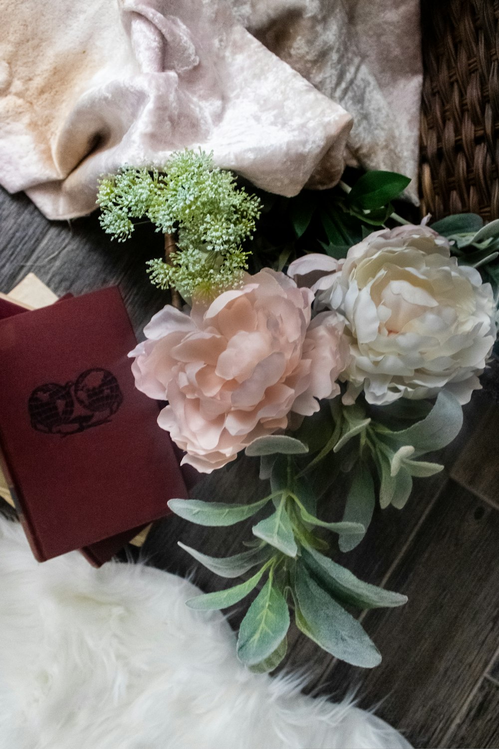 pink and white flowers on red paper