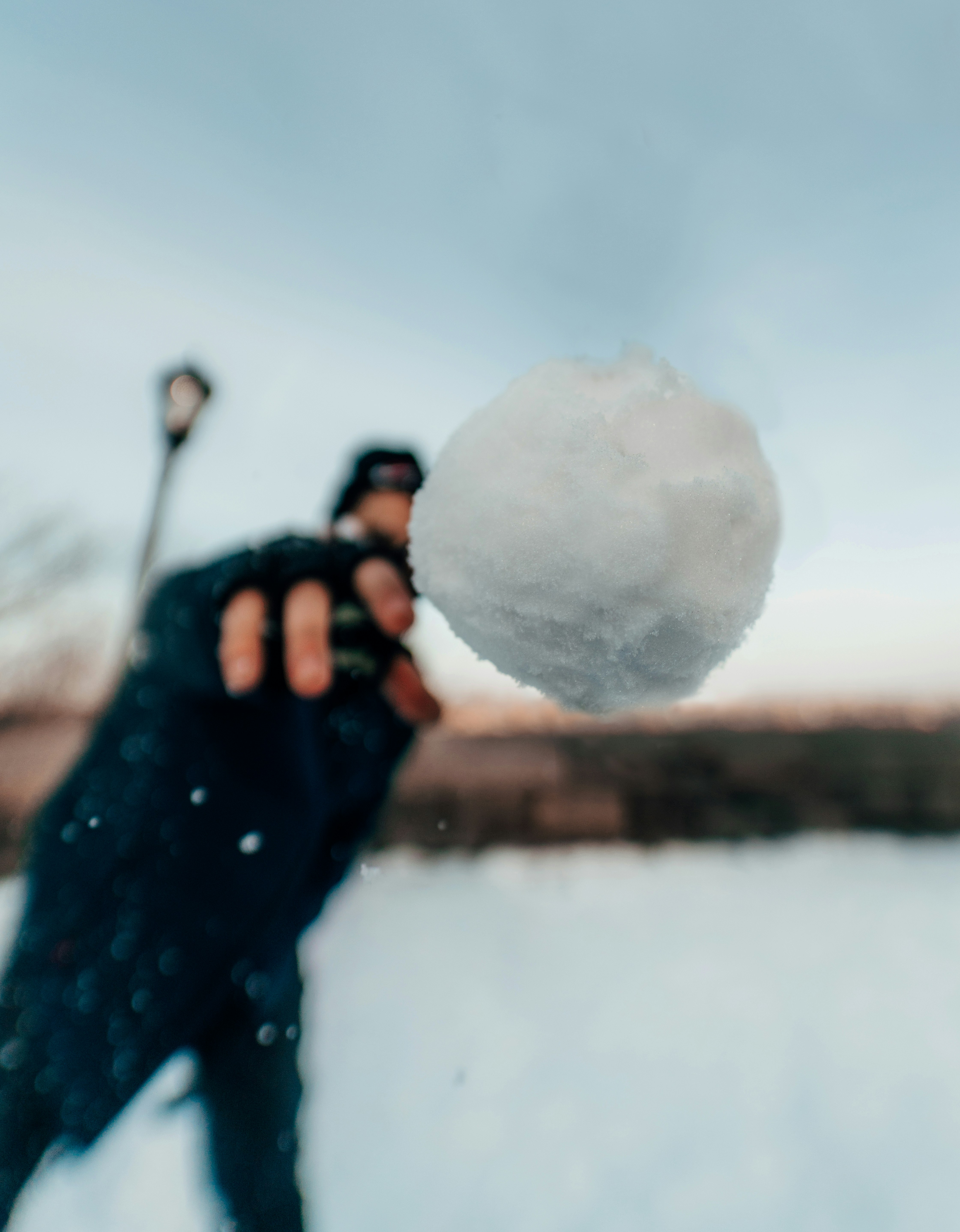 person holding white snow ball