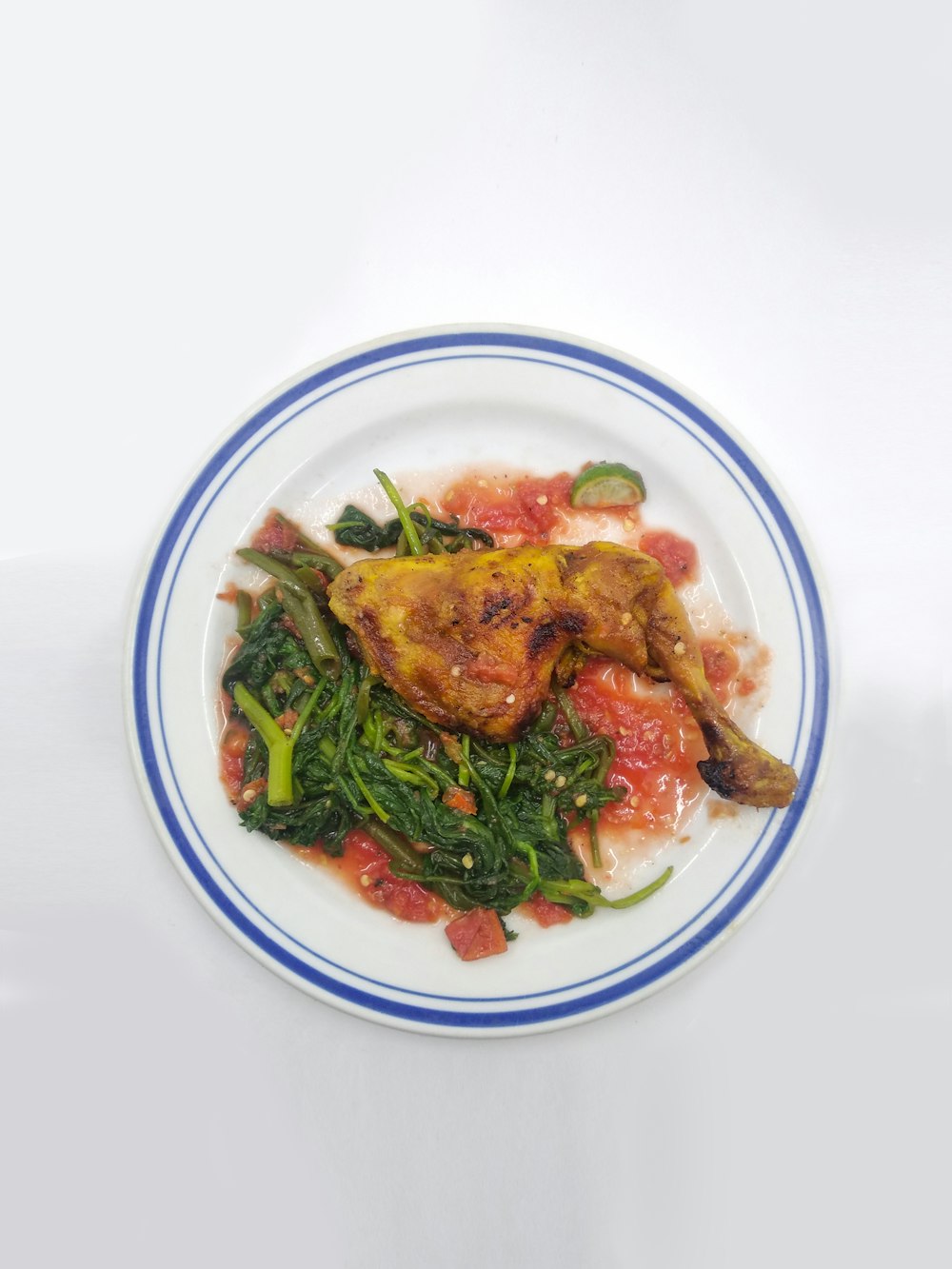 cooked food on white and blue floral ceramic bowl