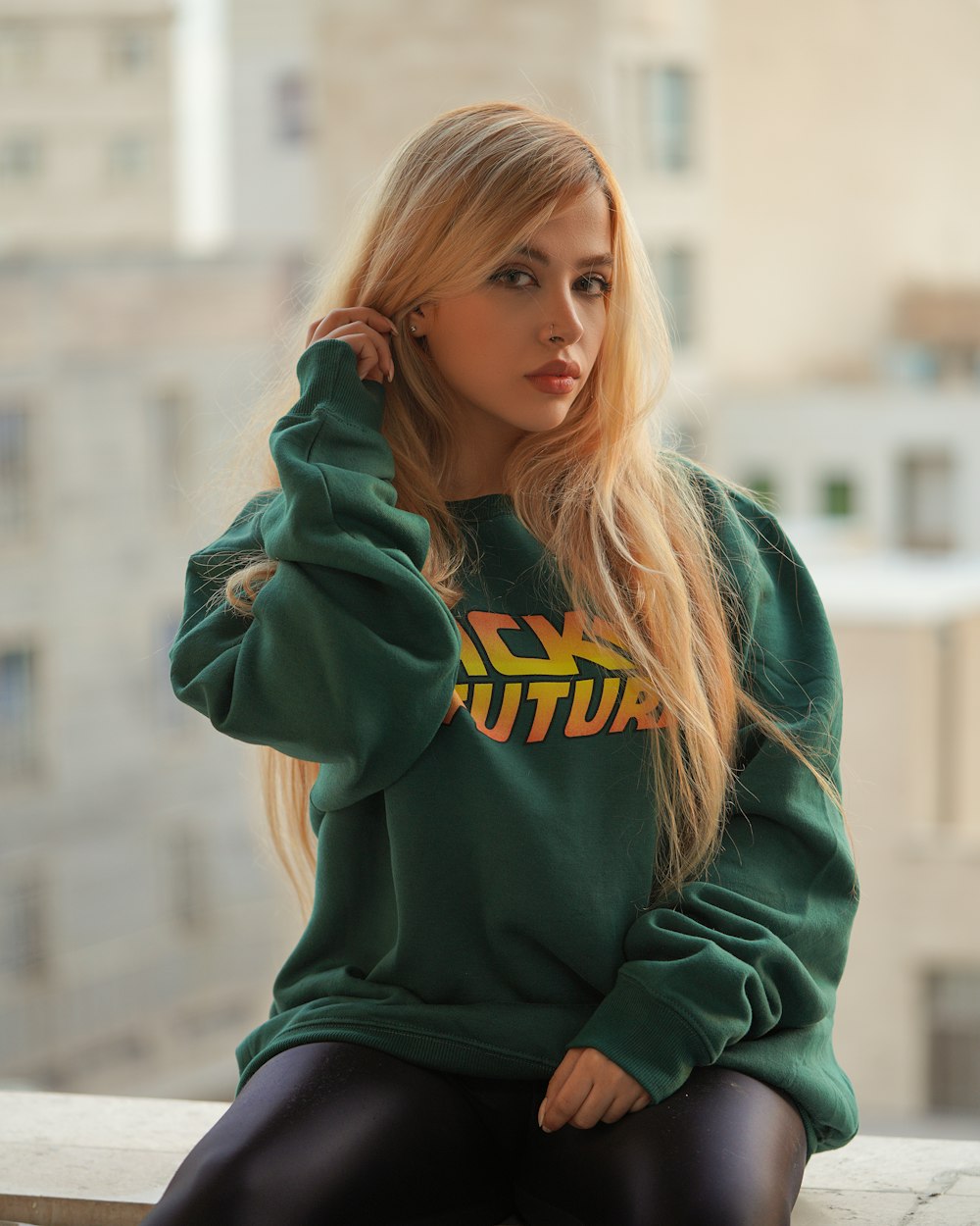 woman in green and yellow hoodie