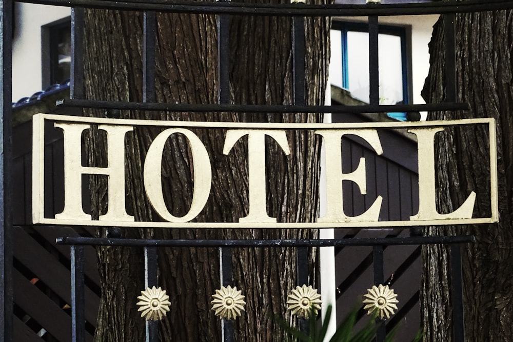 black and white wooden welcome to the beach signage