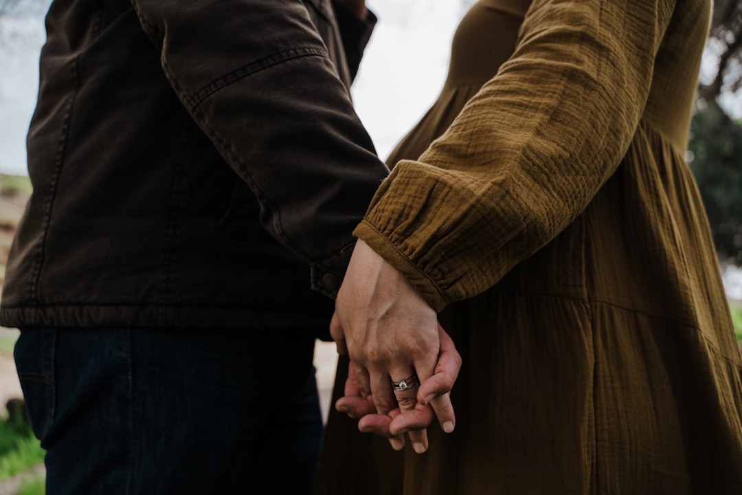 man and woman holding hands