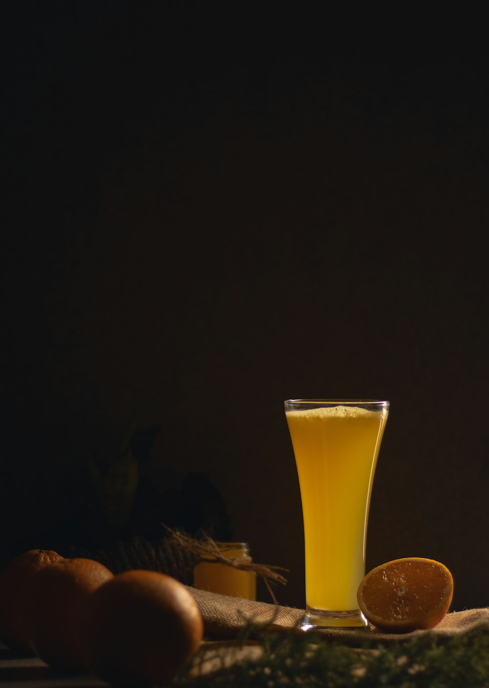 clear drinking glass with yellow liquid