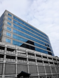A modern office building with a blue and grey color scheme.