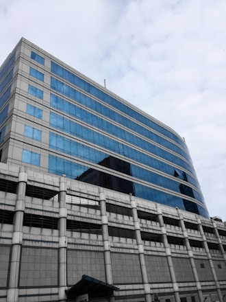 A modern office building with a blue and grey color scheme.