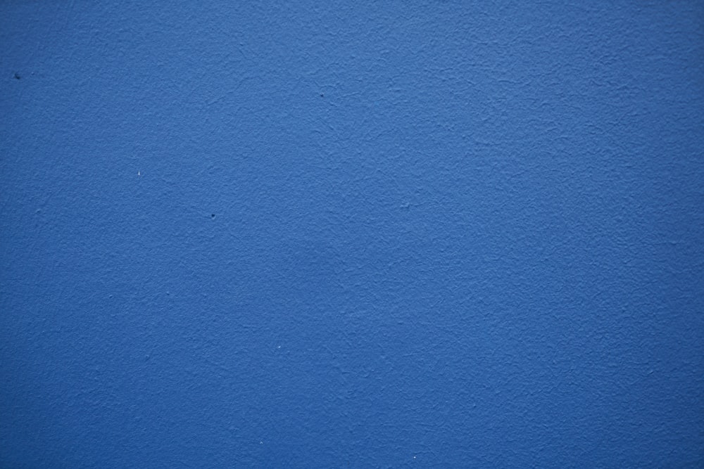 blue painted wall with white paint