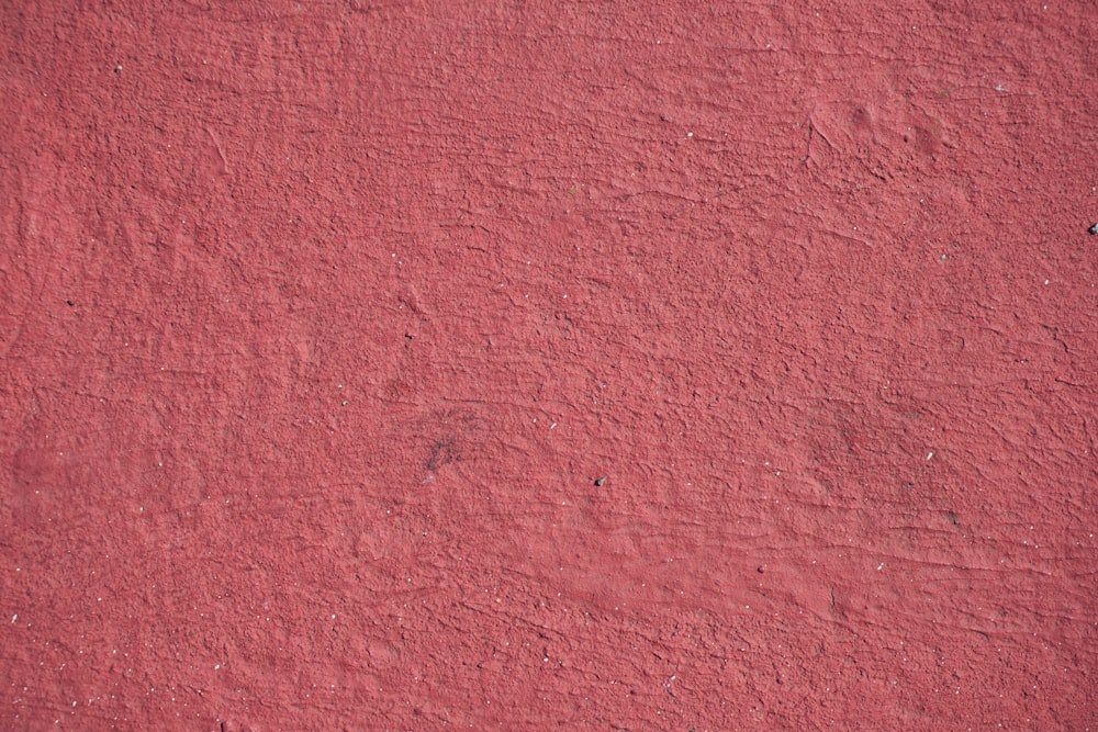 red textile on brown wooden table