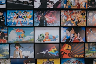 A collection of animated posters arranged in a grid pattern. The images include a mix of famous anime characters, scenes from animated shows, and iconic artwork. Characters from popular series such as Pokémon, Sailor Moon, One Piece, and others are prominently displayed. The overall scene gives off a vibrant and colorful atmosphere.