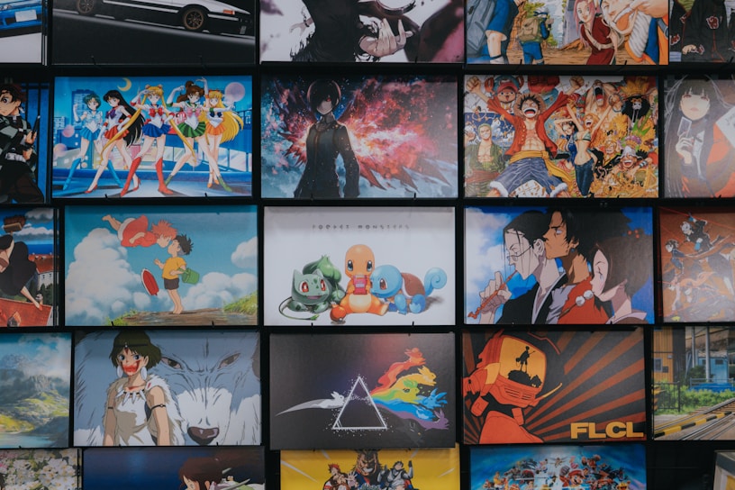 A collection of animated posters arranged in a grid pattern. The images include a mix of famous anime characters, scenes from animated shows, and iconic artwork. Characters from popular series such as Pokémon, Sailor Moon, One Piece, and others are prominently displayed. The overall scene gives off a vibrant and colorful atmosphere.