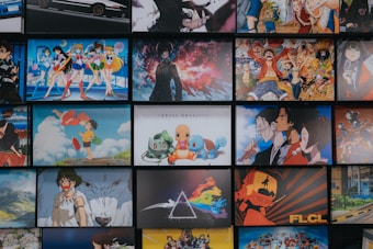 A collection of animated posters arranged in a grid pattern. The images include a mix of famous anime characters, scenes from animated shows, and iconic artwork. Characters from popular series such as Pokémon, Sailor Moon, One Piece, and others are prominently displayed. The overall scene gives off a vibrant and colorful atmosphere.