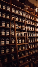 brown wooden shelf with bottles