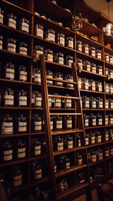 brown wooden shelf with bottles
