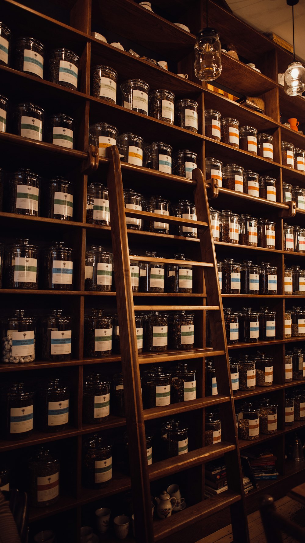 brown wooden shelf with bottles