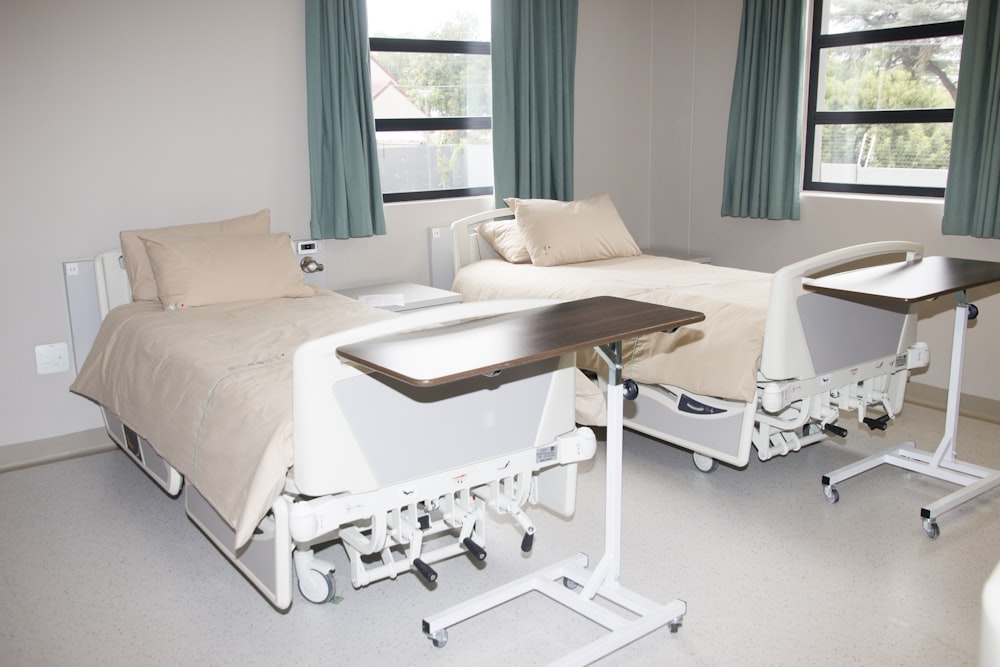 white hospital bed near window