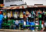 blue plastic chairs and tables on the street