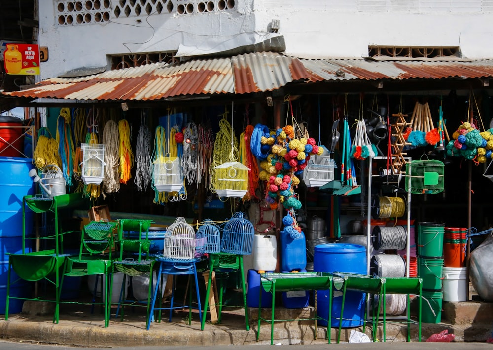 blue plastic chairs and tables on the street