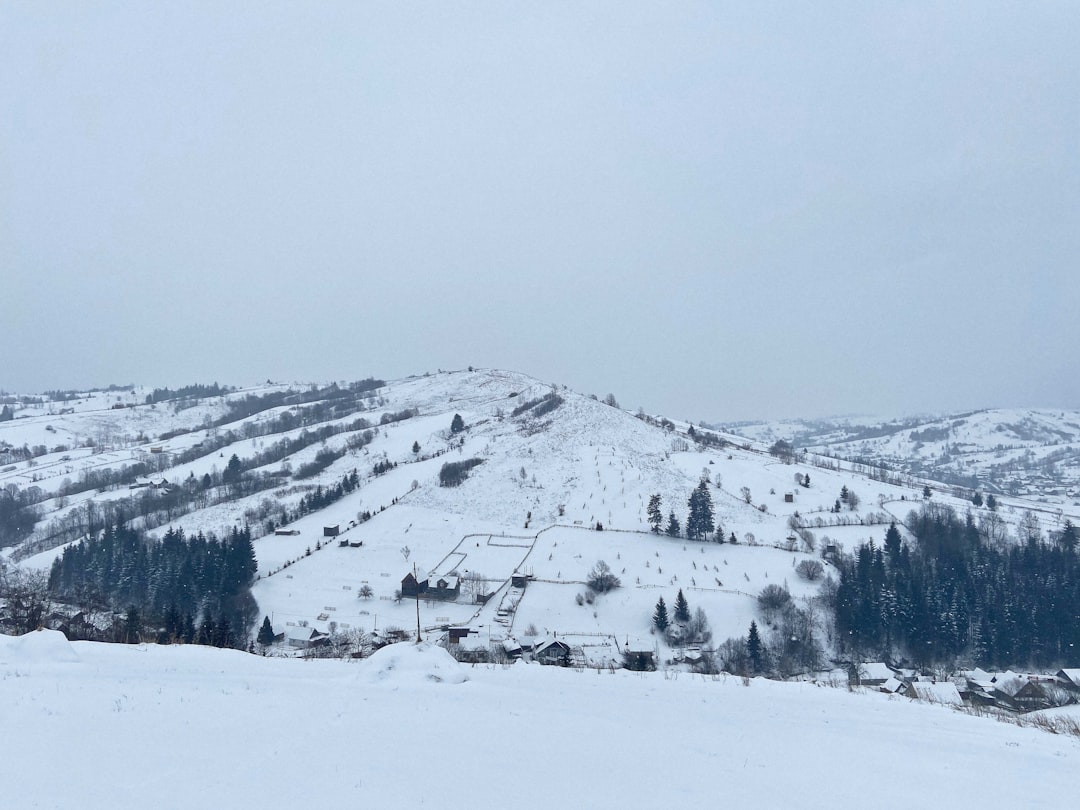 snow covered mountain during daytime