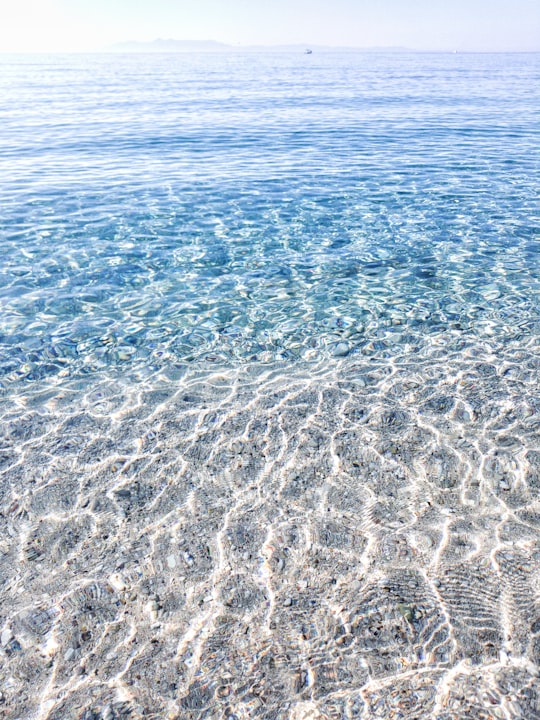 blue body of water during daytime in Livadhja Albania