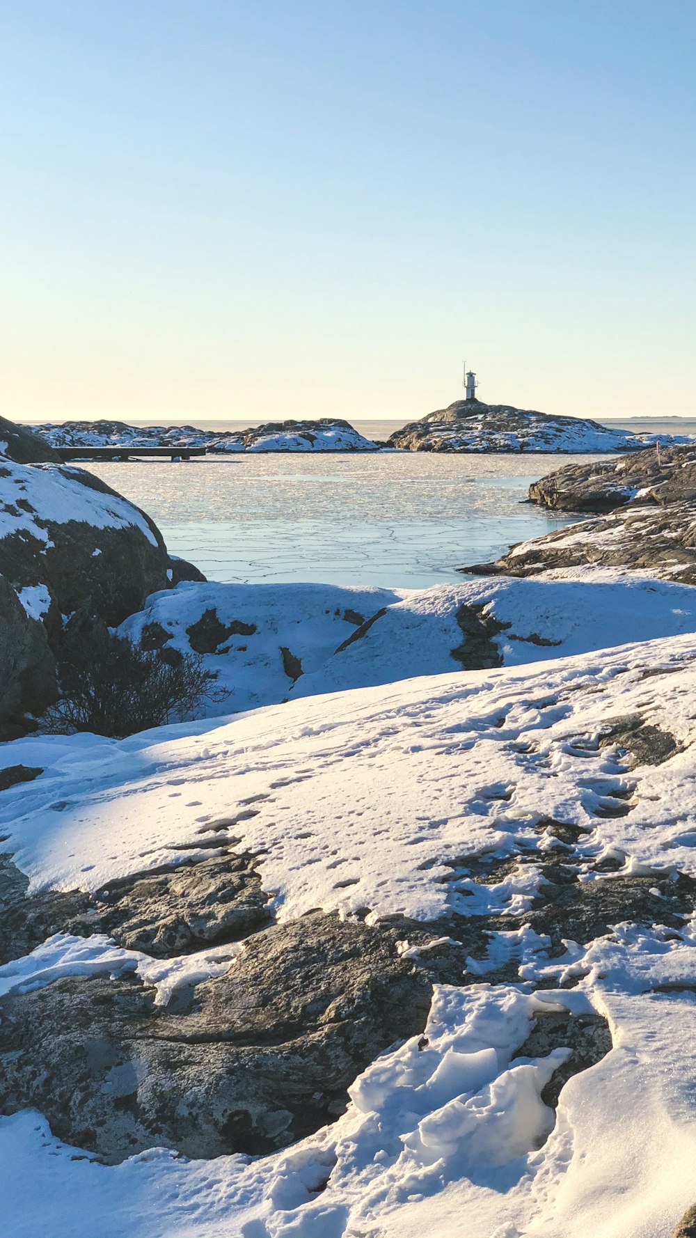 brown rock formation on white snow covered ground during daytime