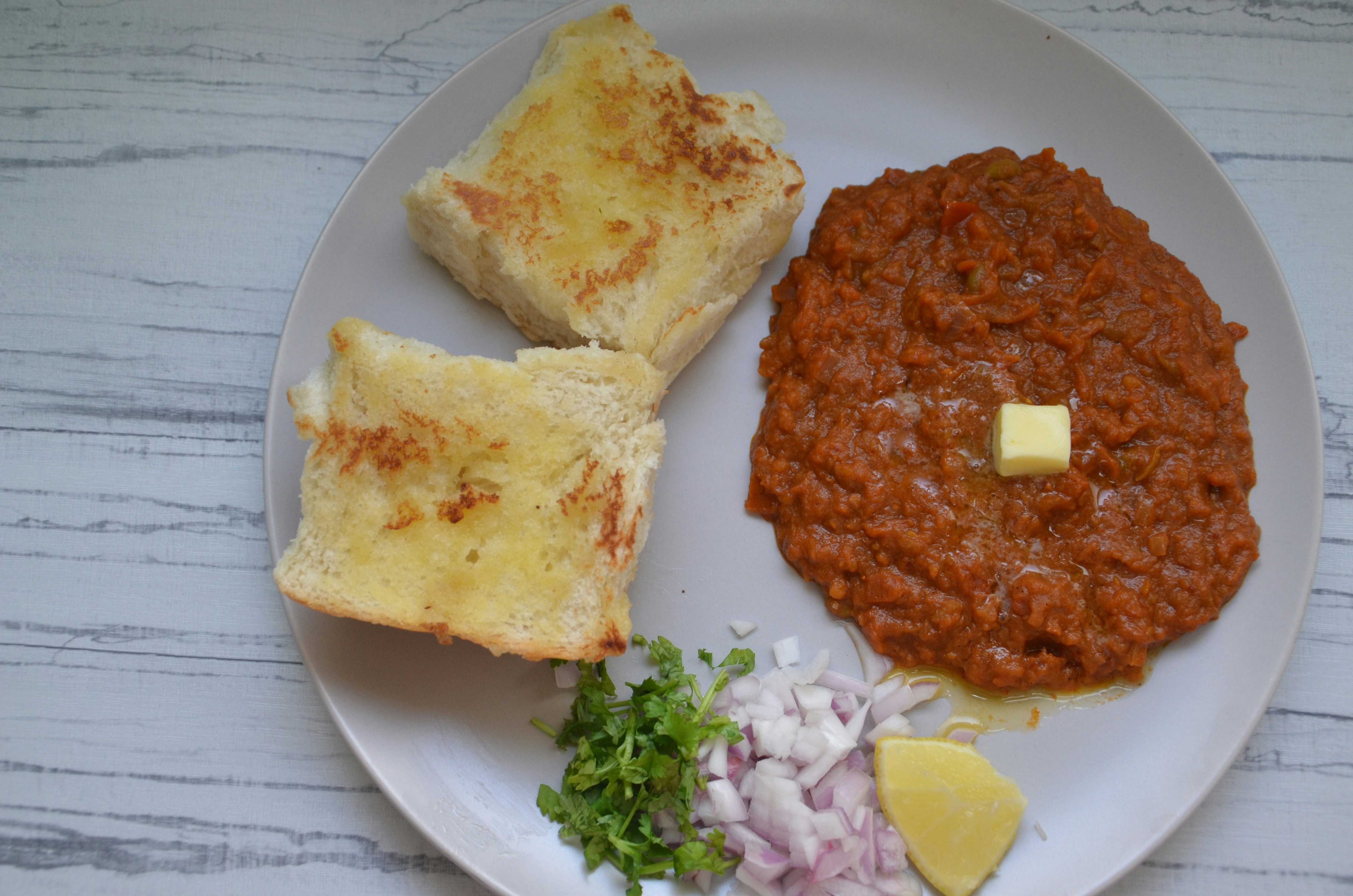 Pav Bhaji Butter — Extra butter pav bhaji, Indian café food photography with warm colours and appetising presentation