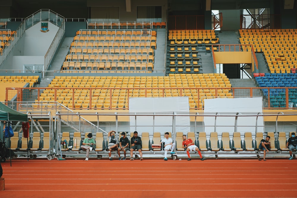 people sitting on bench inside building