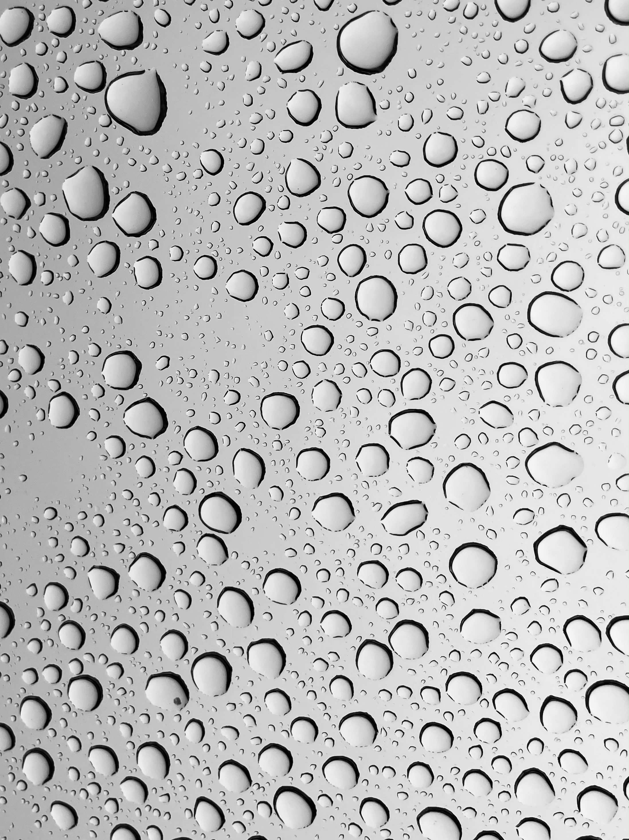 water droplets on gray surface
