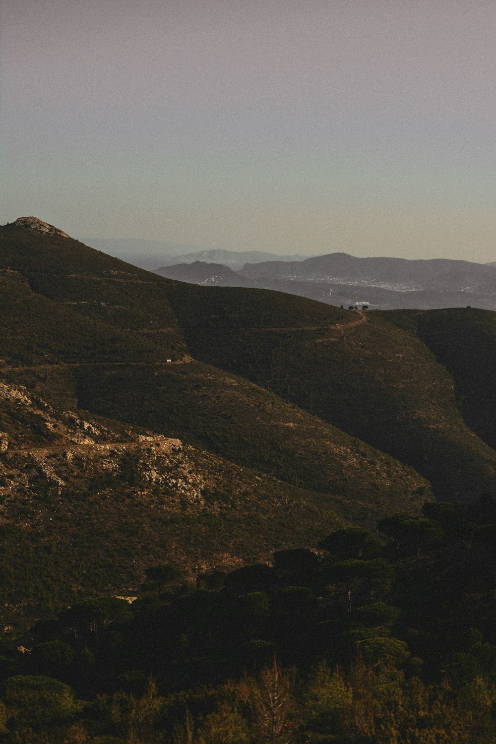 green and brown mountains under blue sky during daytime