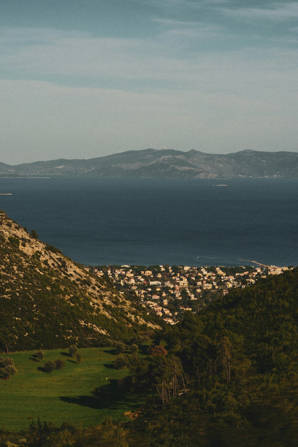 aerial view of city near body of water during daytime